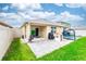 A spacious backyard with a paved patio, a small playhouse, and a trampoline at 339 Spruce Pine Dr, Debary, FL 32713