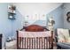 Adorable Bedroom with a cozy crib and Winnie the Pooh-themed decor at 339 Spruce Pine Dr, Debary, FL 32713
