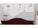 Close-up of a baby crib with Winnie the Pooh decor and a playful mobile at 339 Spruce Pine Dr, Debary, FL 32713