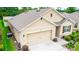 Corner view of a single-Gathering home with a two-car garage and well-maintained landscaping at 339 Spruce Pine Dr, Debary, FL 32713