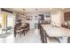 Spacious kitchen and dining area featuring a large island, granite countertops, and modern appliances at 339 Spruce Pine Dr, Debary, FL 32713