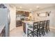 Open kitchen with granite countertops, dark wood cabinets and stainless steel appliances at 339 Spruce Pine Dr, Debary, FL 32713