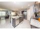 Modern kitchen with stainless steel appliances, granite countertops, and an open layout at 339 Spruce Pine Dr, Debary, FL 32713