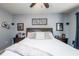 Bedroom featuring a large bed, two nightstands, decorative wall art, and neutral decor at 339 Spruce Pine Dr, Debary, FL 32713