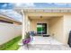 Covered patio area with comfortable seating and slider to the backyard at 339 Spruce Pine Dr, Debary, FL 32713