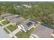 An aerial view of the neighborhood showcasing the tree lined streets and well-spaced homes at 347 Admiralty Ct, Edgewater, FL 32141
