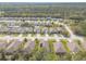 An aerial view of the neighborhood showcasing the tree lined streets and well-spaced homes at 347 Admiralty Ct, Edgewater, FL 32141
