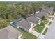 An aerial view of a single-Gathering home with a screened pool and well-maintained landscaping, property outline is shown at 347 Admiralty Ct, Edgewater, FL 32141