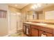 Bright bathroom featuring double sinks, a spacious walk-in shower with glass doors, and modern fixtures at 347 Admiralty Ct, Edgewater, FL 32141