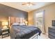 Cozy bedroom with a modern accent wall, complemented by natural light and comfortable furnishings at 347 Admiralty Ct, Edgewater, FL 32141