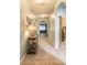 Light-filled hallway with arched doorways connects the living spaces, offering a welcoming ambiance at 347 Admiralty Ct, Edgewater, FL 32141