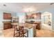 Spacious kitchen with an island, stainless steel appliances, and ample cabinet space at 347 Admiralty Ct, Edgewater, FL 32141