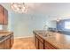 Kitchen with stainless steel appliances, center island, and view to the living area at 347 Admiralty Ct, Edgewater, FL 32141