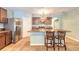 Kitchen with stainless steel appliances, breakfast bar, and tile floors at 347 Admiralty Ct, Edgewater, FL 32141