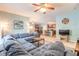 Cozy living room showcasing an open floor plan with kitchen and dining views at 347 Admiralty Ct, Edgewater, FL 32141