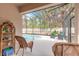 Outdoor screened in pool area with patio furniture and a beautiful pool view at 347 Admiralty Ct, Edgewater, FL 32141