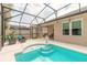 Screened in pool and patio area features seating, steps, and views into the backyard at 347 Admiralty Ct, Edgewater, FL 32141