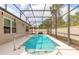 A screened in in-ground pool features turtle designs, a safety bar, and covered lanai area at 347 Admiralty Ct, Edgewater, FL 32141