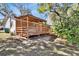 A beautiful wooden porch with ample seating and a covered area perfect for relaxing outdoors at 351 W Holly Dr, Orange City, FL 32763