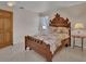 Well-lit bedroom features a wood bed frame and a lamp on a bedside table at 351 W Holly Dr, Orange City, FL 32763
