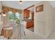 Bright dining area featuring tile floors, wood cabinets, and a view of the yard at 351 W Holly Dr, Orange City, FL 32763