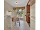 Bright dining area featuring tile floors, natural light, and a view of the deck at 351 W Holly Dr, Orange City, FL 32763