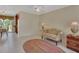 Bright living room showcasing tile floors, neutral walls, and natural lighting at 351 W Holly Dr, Orange City, FL 32763