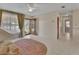 Open-concept interior featuring tile floors, neutral walls, and a view of the yard at 351 W Holly Dr, Orange City, FL 32763