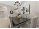 Elegant dining room with modern chandelier and a decorative painting at 39 Wentwood Dr, Debary, FL 32713