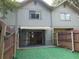 Backyard with privacy fence and sliding glass doors to the home at 3960 Willow Trail Run # 45, Port Orange, FL 32127
