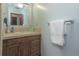 Charming bathroom features a wood vanity, neutral countertops, and tile backsplash at 3960 Willow Trail Run # 45, Port Orange, FL 32127