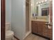 Bathroom featuring tile floors, a shower, a vanity with a sink, and a toilet at 3960 Willow Trail Run # 45, Port Orange, FL 32127