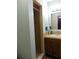 Bathroom featuring a walk-in shower with beautiful tile and a vanity with a decorative mirror at 3960 Willow Trail Run # 45, Port Orange, FL 32127