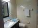 This bathroom features tiled walls, a decorative bird, and a clean white towel on the rack at 3960 Willow Trail Run # 45, Port Orange, FL 32127