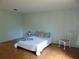Bedroom featuring neutral walls, tile floors, and a queen bed at 3960 Willow Trail Run # 45, Port Orange, FL 32127