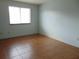 This bedroom has a window with natural light and neutral paint with ceramic tile floors at 3960 Willow Trail Run # 45, Port Orange, FL 32127