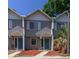 Townhome exterior with neutral gray siding, white trim, and blue front doors at 3960 Willow Trail Run # 45, Port Orange, FL 32127