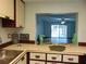 View from kitchen into the living room shows serving counter at 3960 Willow Trail Run # 45, Port Orange, FL 32127