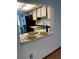 Pass-through kitchen with white cabinets and dining area at 3960 Willow Trail Run # 45, Port Orange, FL 32127