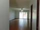 Spacious living room with tile floors, ceiling fan, and sliding glass doors to the patio at 3960 Willow Trail Run # 45, Port Orange, FL 32127