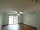 Open living area with tile floors and sliding glass doors to the backyard at 3960 Willow Trail Run # 45, Port Orange, FL 32127