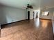 Spacious living room with tile flooring, ceiling fan, and light blue walls at 3960 Willow Trail Run # 45, Port Orange, FL 32127