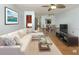 Inviting living room with a comfortable sectional sofa, modern decor, and a seamless flow to the dining area at 3960 Willow Trail Run # 45, Port Orange, FL 32127