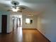 Bright living room with tile flooring, ceiling fan, and view of the kitchen at 3960 Willow Trail Run # 45, Port Orange, FL 32127