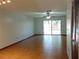 The living room has ceramic tile flooring and sliding glass doors to the outdoor space at 3960 Willow Trail Run # 45, Port Orange, FL 32127