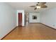 Open living area with tile flooring, a ceiling fan, and convenient access to other rooms in the home at 3960 Willow Trail Run # 45, Port Orange, FL 32127