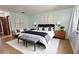 Inviting main bedroom with stylish decor, seating area, and ensuite bath access at 3960 Willow Trail Run # 45, Port Orange, FL 32127