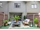 Charming patio with stylish outdoor furniture, lush greenery, and a privacy fence for relaxation at 3960 Willow Trail Run # 45, Port Orange, FL 32127