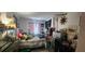 Bright bedroom with a double bed, playful decor and a large fish tank at 411 Banana Cay Dr # C, South Daytona, FL 32119