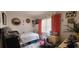 Bedroom with natural light, bed, dresser, and eclectic decor at 411 Banana Cay Dr # C, South Daytona, FL 32119